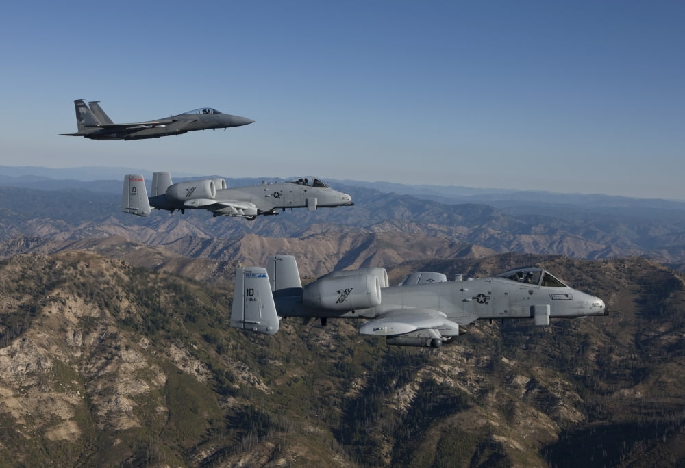 An F-15 Eagle and two A-10 Thunderbolts in flight over Central Idaho Canvas Art - HIGH-G ProductionsStocktrek Images (35 x 24)