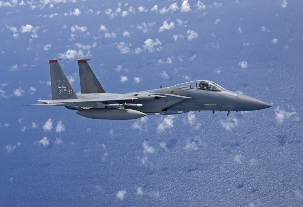 An F-15 Eagle flies over the Pacific Ocean during a training mission Canvas Art - HIGH-G ProductionsStocktrek Images (18 x 12)