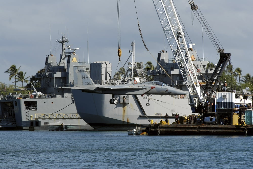 An F-15 Eagle gets a lift from a barge crane Canvas Art - Stocktrek Images (34 x 23)