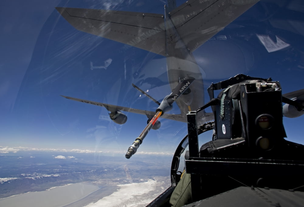 An F-15 Eagle pulls into position behind a KC-135 Stratotanker Canvas Art - HIGH-G ProductionsStocktrek Images (18 x 12)