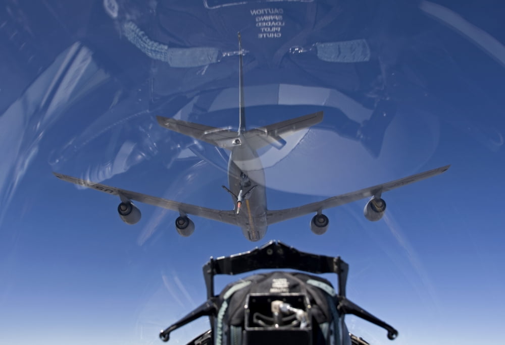 An F-15 Eagle pulls into position behind a KC-135 Stratotanker Canvas Art - HIGH-G ProductionsStocktrek Images (35 x 24)
