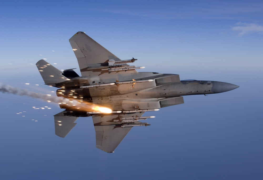 An F-15 Eagle releases a flare while breaking hard to the left Canvas Art - HIGH-G ProductionsStocktrek Images (35 x 24)