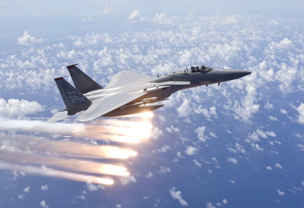 An F-15 Eagle releases flares over the Pacific Ocean Canvas Art - HIGH-G ProductionsStocktrek Images (18 x 12)