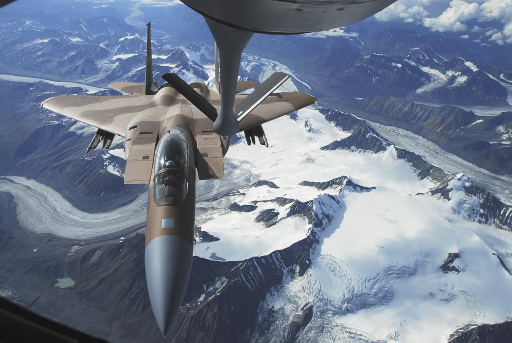 An F-15C Eagle aircraft sits behind a KC-135R Stratostanker Canvas Art - Stocktrek Images (34 x 23)