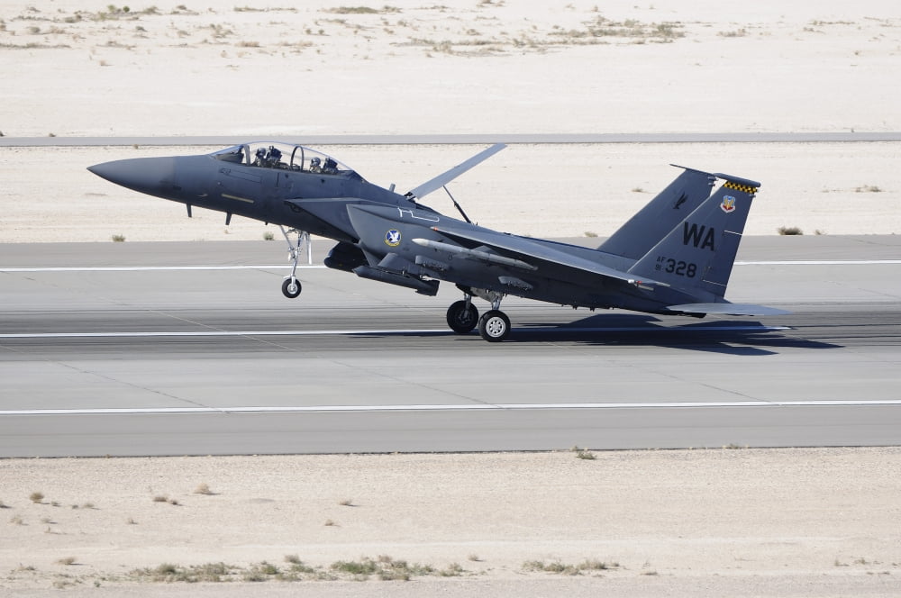 An F-15C Eagle landing on the runway at Nellis Air Force Base Canvas Art - Remo GuidiStocktrek Images (17 x 12)