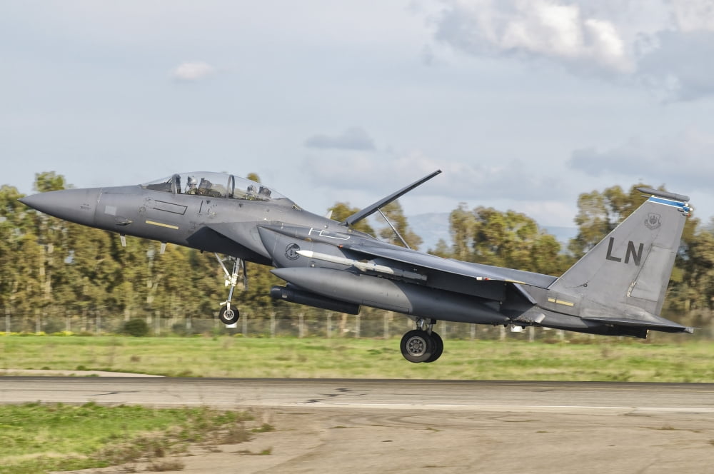An F-15E Strike Eagle deploys from Decimomannu Air Base Italy Canvas Art - Giovanni CollaStocktrek Images (35 x 24)