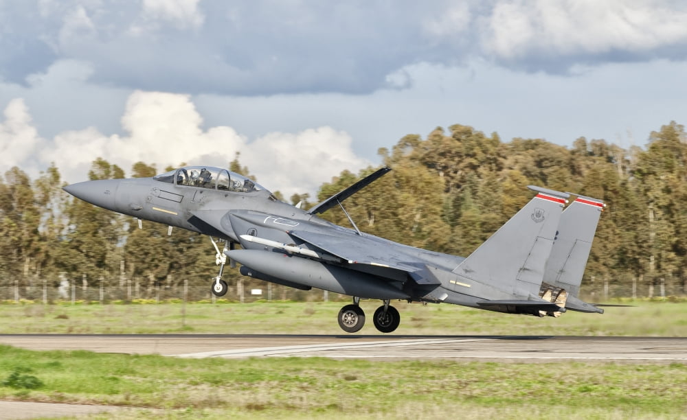 An F-15E Strike Eagle deploys from Decimomannu Air Base Italy Canvas Art - Giovanni CollaStocktrek Images (36 x 22)