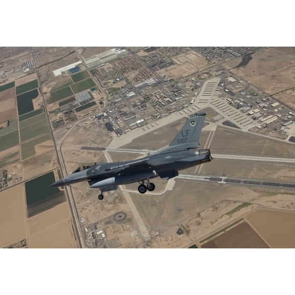An F-16 Fighting Falcon in flight over Luke Air Force Base  Arizona Poster Print