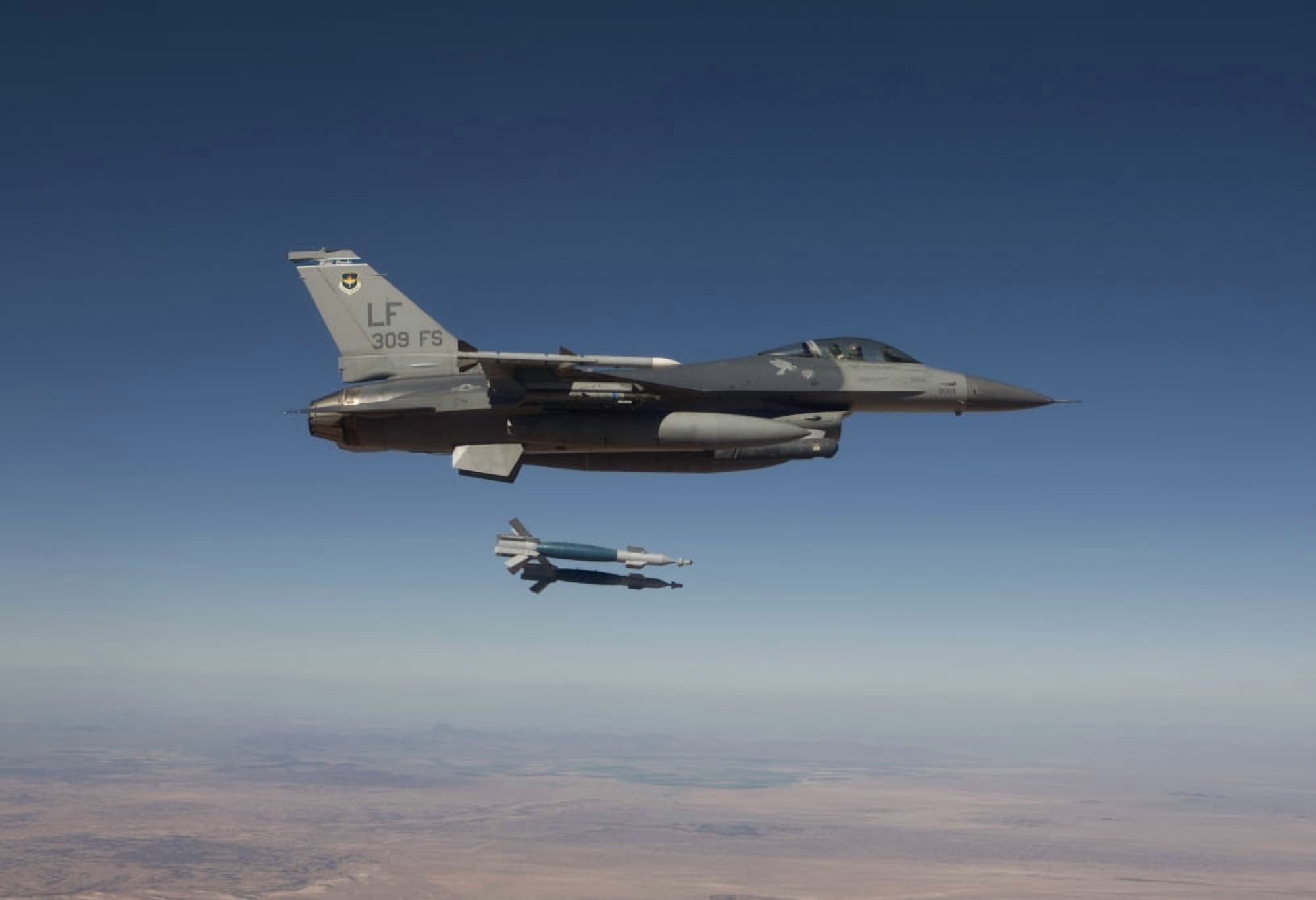 An F-16 Fighting Falcon releases two GBU-12 laser guided bombs Canvas Art - HIGH-G ProductionsStocktrek Images (35 x 24)