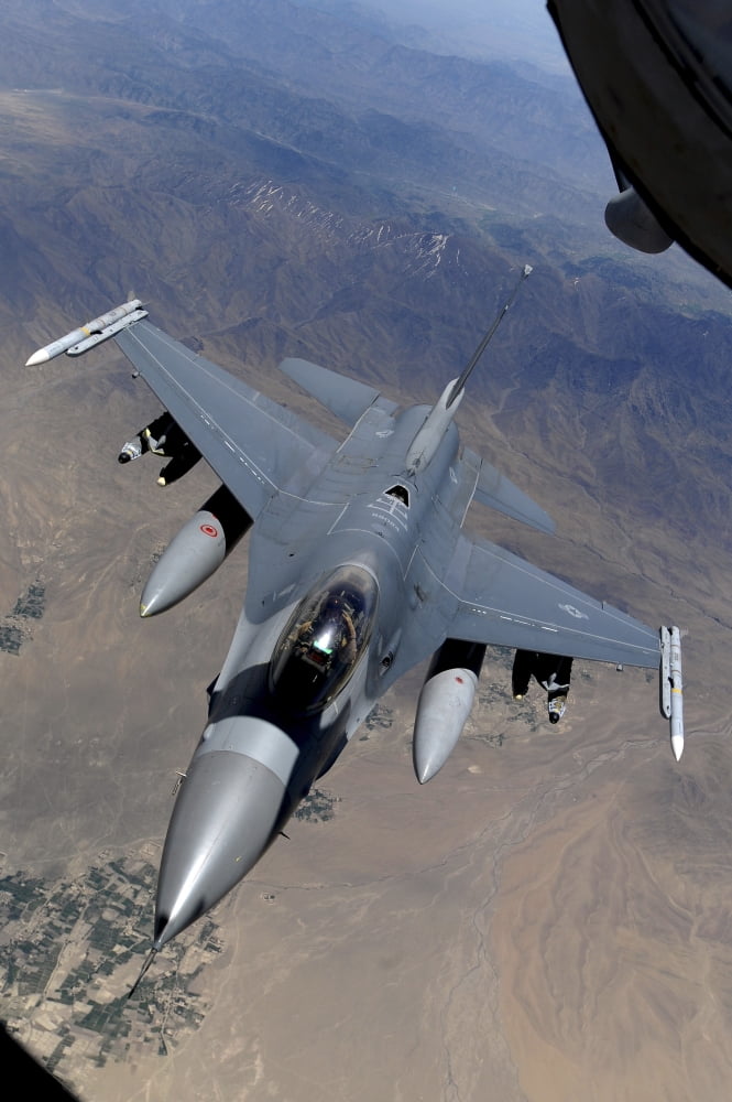 An F-16 Fighting Falcon returns to mission after refueling from a KC-135 Stratotanker Canvas Art - Stocktrek Images (23 x 35)