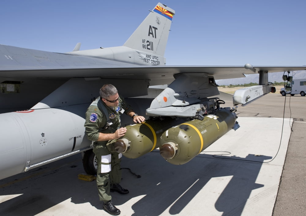 An F-16 pilot conducts a preflight check on a weapon prior to a mission Canvas Art - HIGH-G ProductionsStocktrek Images (17 x 12)