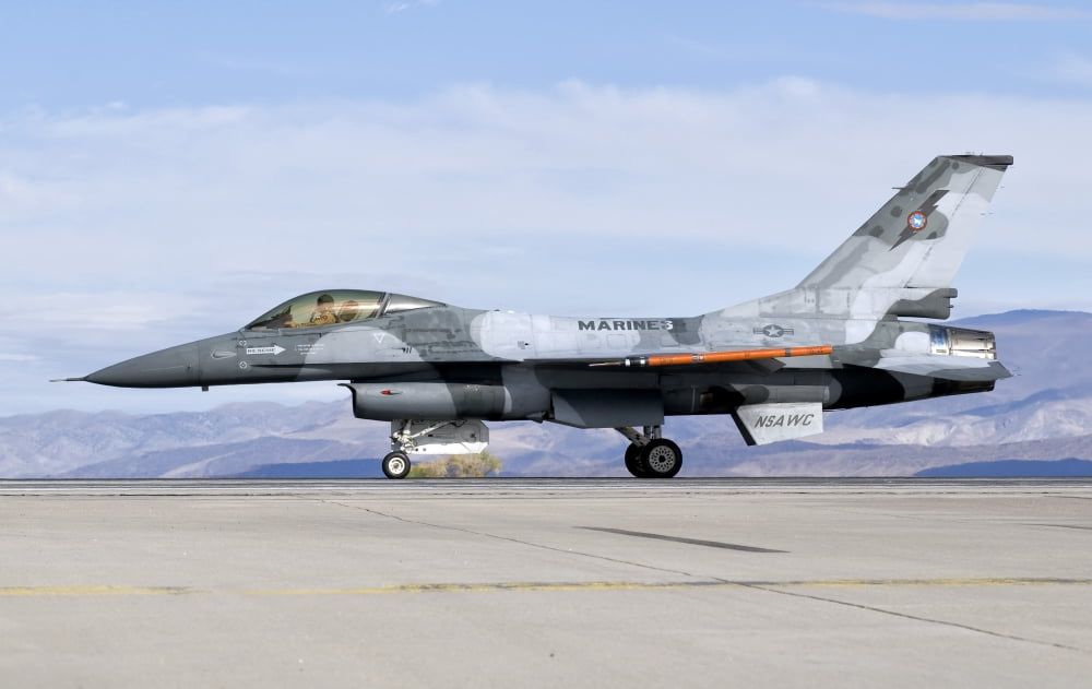 An F-16A Fighting Falcon of the famous US Navy TOPGUN Naval Fighter Weapons School Canvas Art - Giovanni CollaStocktrek Images (18 x 11)