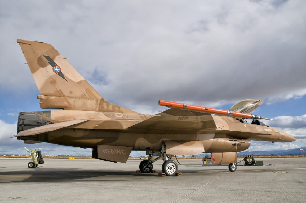 An F-16A Fighting Falcon of the famous US Navy TOPGUN Naval Fighter Weapons School Canvas Art - Giovanni CollaStocktrek Images (18 x 12)