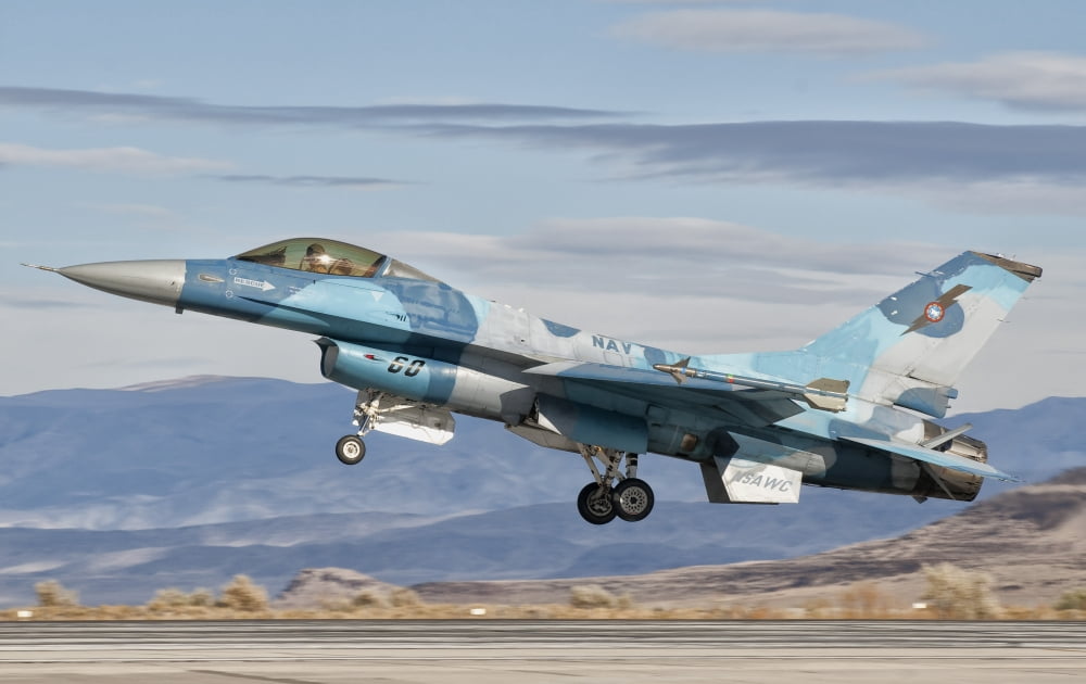 An F-16A Fighting Falcon of the famous US Navy TOPGUN Naval Fighter Weapons School Canvas Art - Giovanni CollaStocktrek Images (36 x 23)