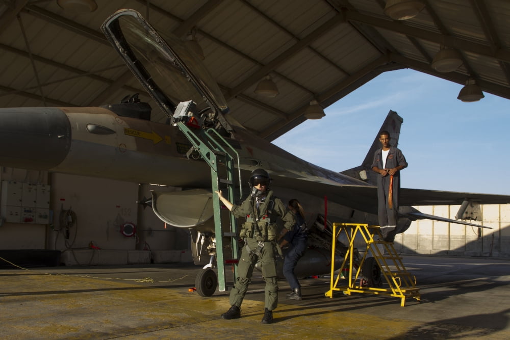 An F-16A Netz of the Israel Air Force parked in the hangar at Nevatim Air Force Base Canvas Art - Ofer ZidonStocktrek Images (18 x 12)