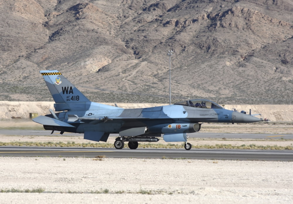 An F-16C Aggressor jet landing on runway in Nevada Canvas Art - Riccardo NiccoliStocktrek Images (17 x 12)