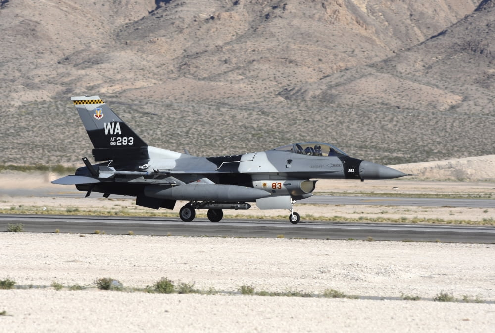 An F-16C Aggressor jet landing on runway in Nevada Canvas Art - Riccardo NiccoliStocktrek Images (17 x 12)