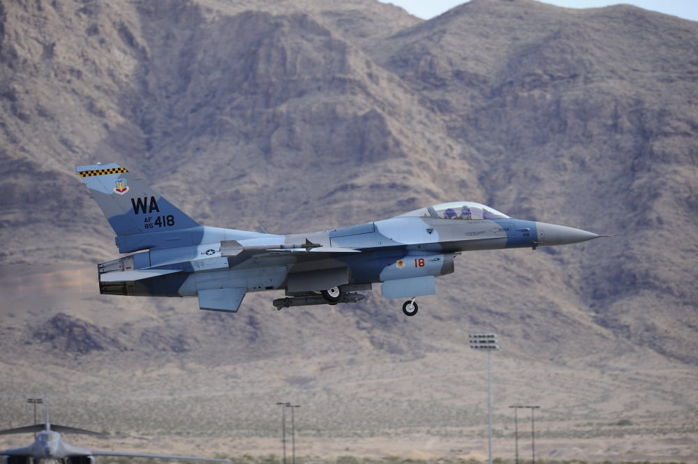 An F-16C Falcon of the 65th Aggressor Squadron taking off Canvas Art - Remo GuidiStocktrek Images (35 x 23)