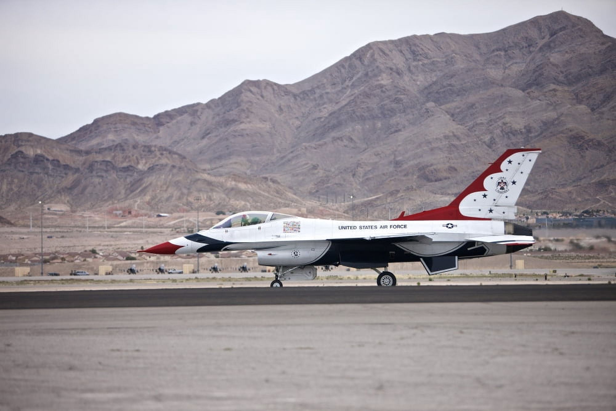 An F-16C Thunderbird sits on the runway at Nellis Air Force Base Nevada Canvas Art - Terry MooreStocktrek Images (35 x 23)