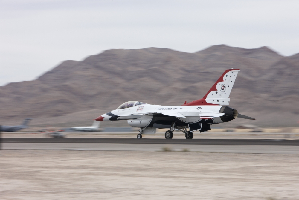 An F-16C Thunderbird sits on the runway at Nellis Air Force Base Nevada Canvas Art - Terry MooreStocktrek Images (35 x 23)