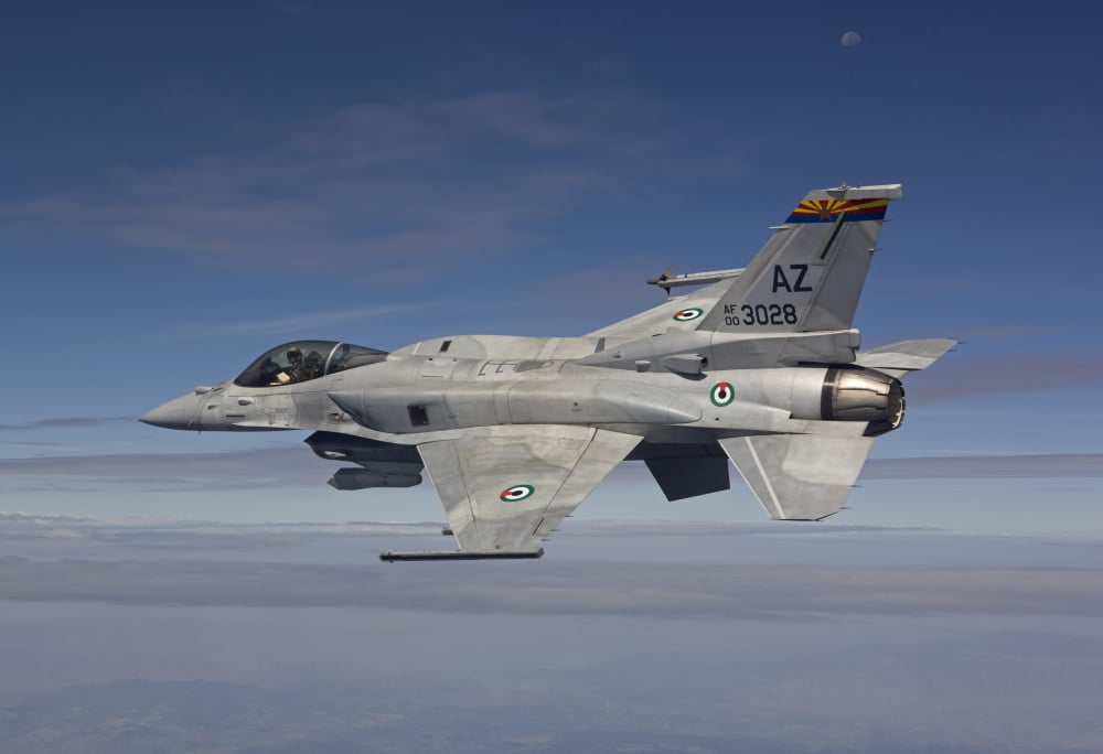 An F-16E maneuvers during a training mission over Arizona Canvas Art - HIGH-G ProductionsStocktrek Images (18 x 12)