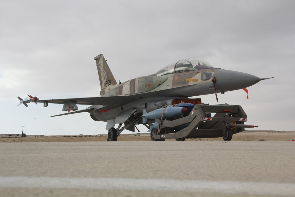 An F-16I Sufa of the Israeli Air Force ready to be armed with practice bombs Canvas Art - Ofer ZidonStocktrek Images (35 x 23)