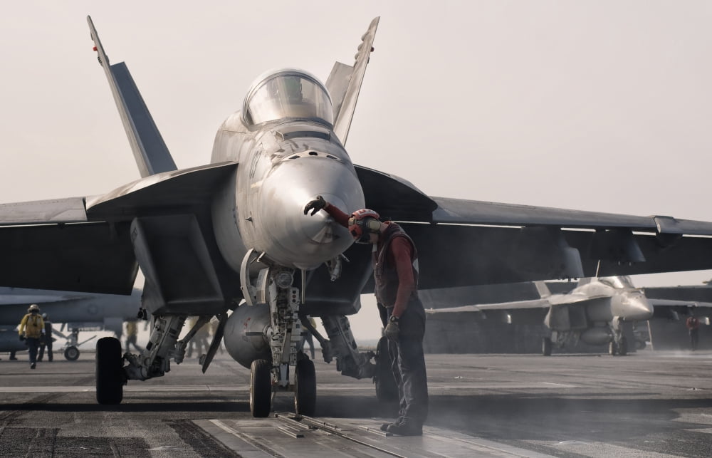 An F-18E Super Hornet is guided into catapult aboard USS George HW Bush Canvas Art - Giovanni CollaStocktrek Images (18 x 12)