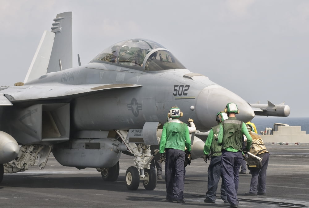 An F-18F Super Hornet is guided into catapult aboard USS George HW Bush Canvas Art - Giovanni CollaStocktrek Images (35 x 23)