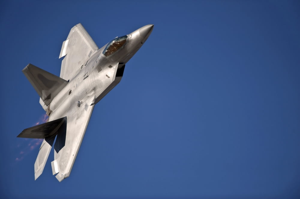 An F-22 Raptor aircraft performs during Aviation Nation 2010 Canvas Art - Stocktrek Images (34 x 23)