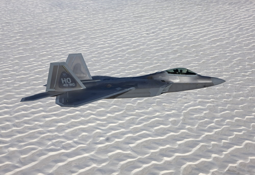An F-22 Raptor flies around Southern New Mexico Canvas Art - HIGH-G ProductionsStocktrek Images (35 x 24)