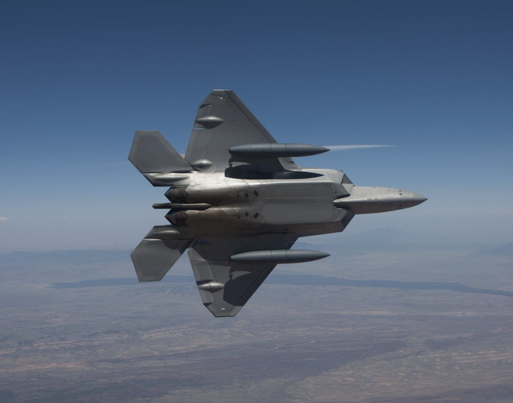 An F-22 Raptor maneuvers while flying a training mission over New Mexico Canvas Art - HIGH-G ProductionsStocktrek Images (16 x 13)