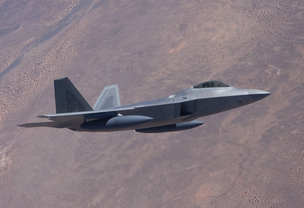 An F-22 Raptor on a training mission Canvas Art - HIGH-G ProductionsStocktrek Images (35 x 24)