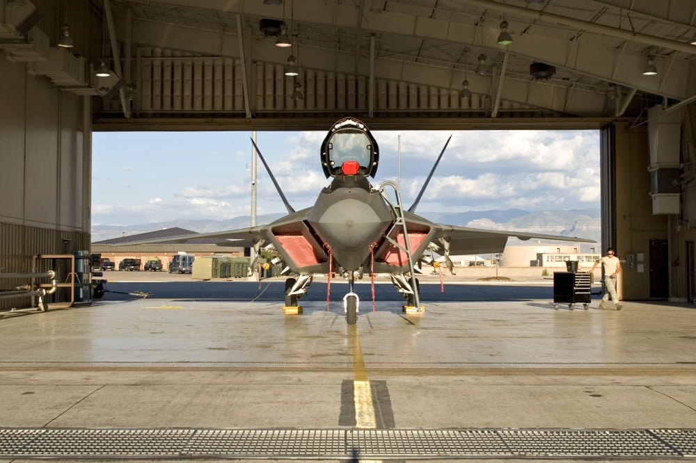 An F-22 Raptor parked in the hangar at Holloman Air Force Base Canvas Art - HIGH-G ProductionsStocktrek Images (18 x 12)