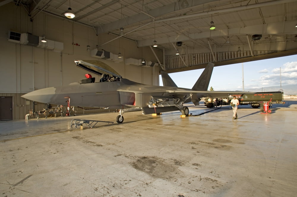 An F-22 Raptor parked in the hangar at Holloman Air Force Base Canvas Art - HIGH-G ProductionsStocktrek Images (18 x 12)