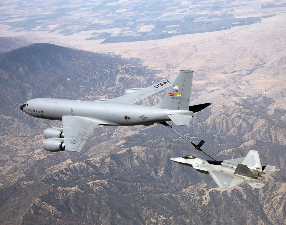 An F-22 Raptor receives fuel from a KC-135 Stratotanker Canvas Art - Stocktrek Images (32 x 26)