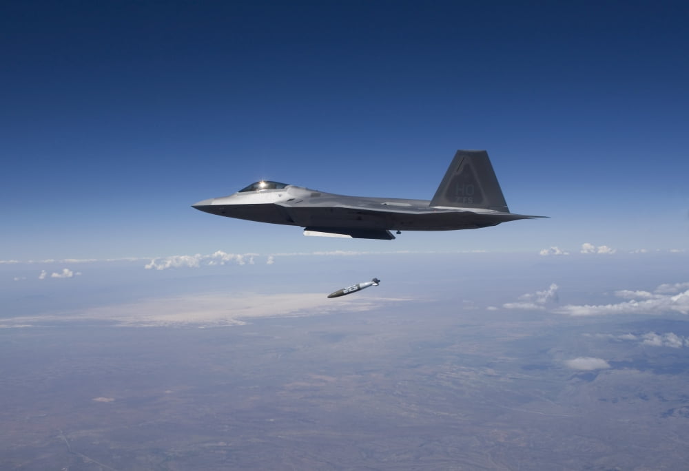 An F-22 Raptor releases a GBU-32 JDAM over New Mexico Canvas Art - HIGH-G ProductionsStocktrek Images (18 x 12)