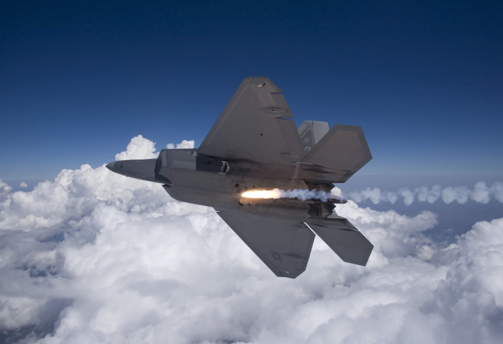 An F-22 Raptor releases a flare during a training mission Canvas Art - HIGH-G ProductionsStocktrek Images (18 x 12)