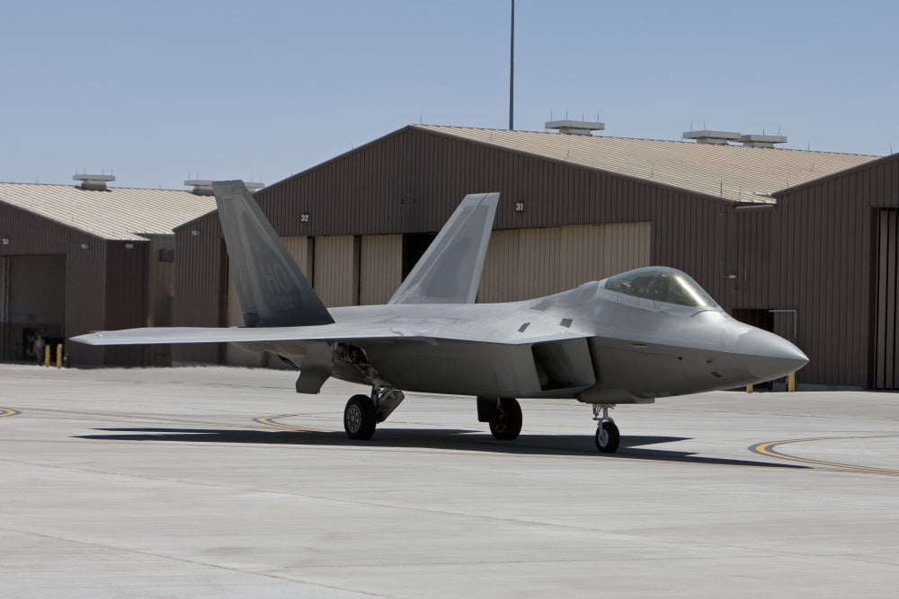 An F-22 Raptor taxis to the runway for a training mission Canvas Art - HIGH-G ProductionsStocktrek Images (18 x 12)