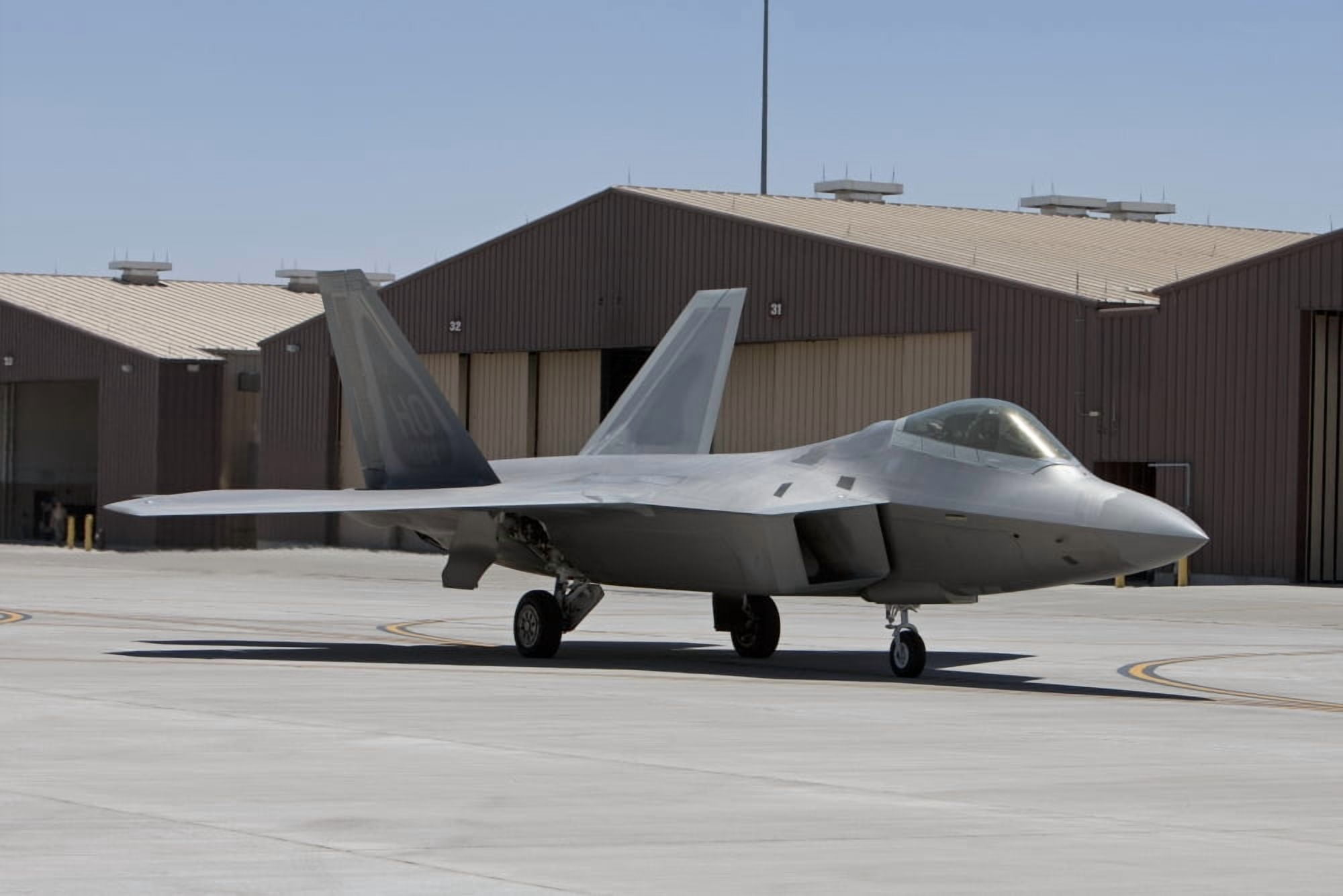 An F-22 Raptor taxis to the runway for a training mission Canvas Art - HIGH-G ProductionsStocktrek Images (35 x 23)