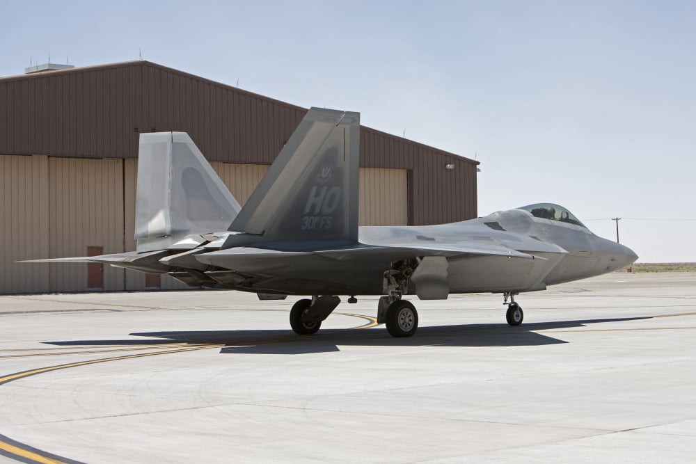 An F-22 Raptor taxis to the runway for a training mission Canvas Art - HIGH-G ProductionsStocktrek Images (35 x 23)