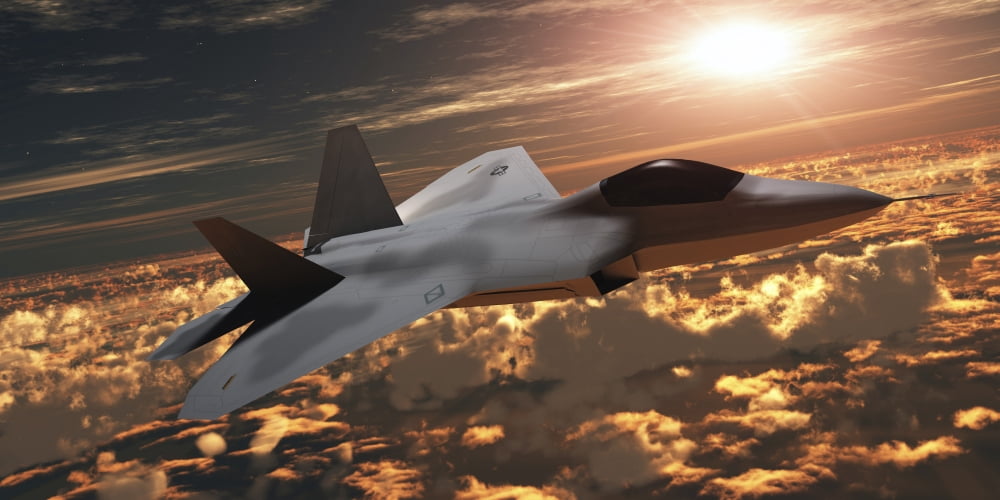 An F-22 fighter jet flies at an altitude above the cloud layer on its mission Canvas Art - Corey FordStocktrek Images (20 x 10)
