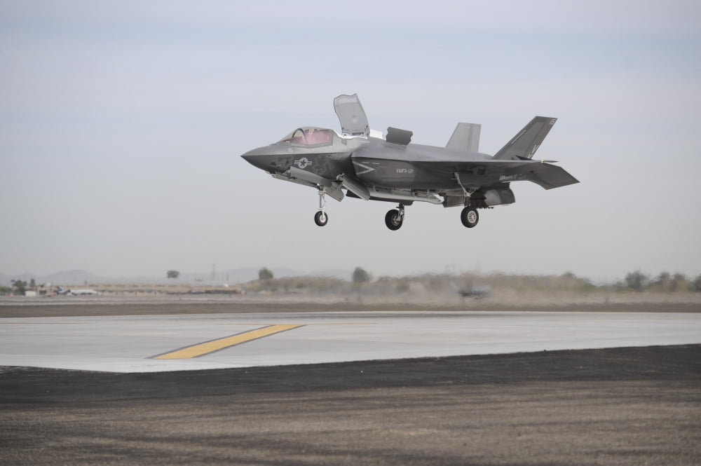 An F-35B Lightning II Joint Strike Fighter prepares to make a vertical landing Canvas Art - Stocktrek Images (35 x 23)