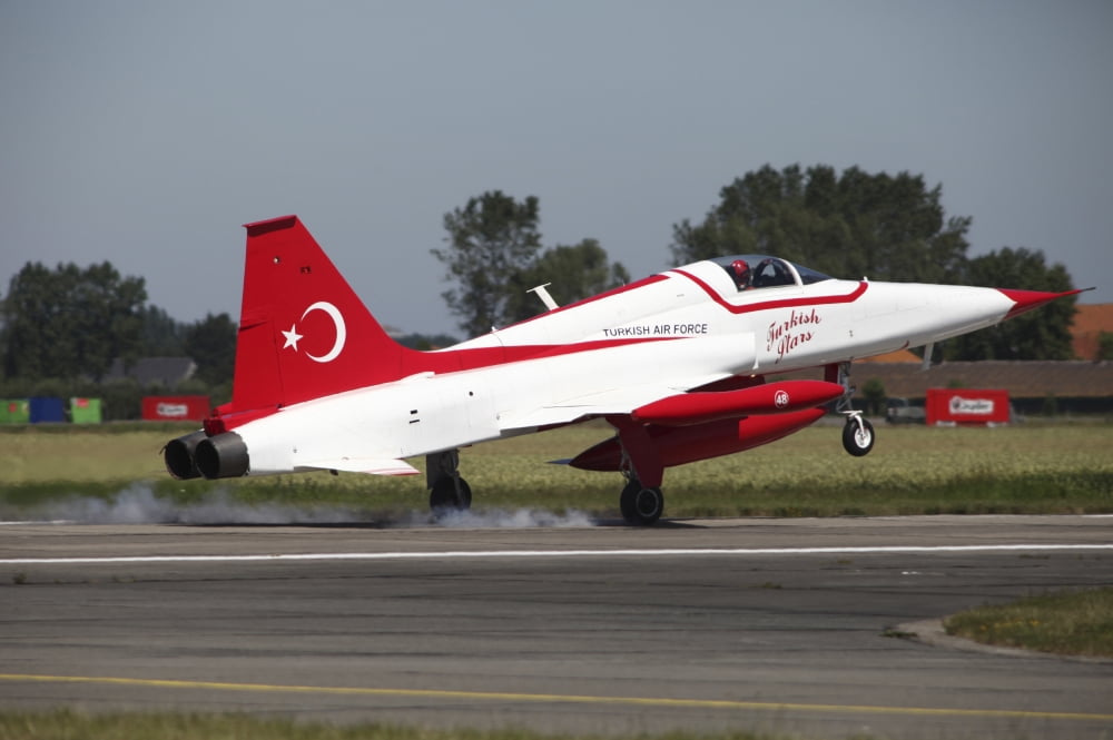 An F-5 jet of the Turkish Stars aerobatic demonstration team Canvas Art - Timm ZiegenthalerStocktrek Images (18 x 12)