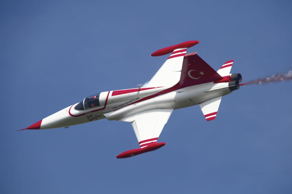 An F-5 jet of the Turkish Stars aerobatic demonstration team Canvas Art - Timm ZiegenthalerStocktrek Images (35 x 23)