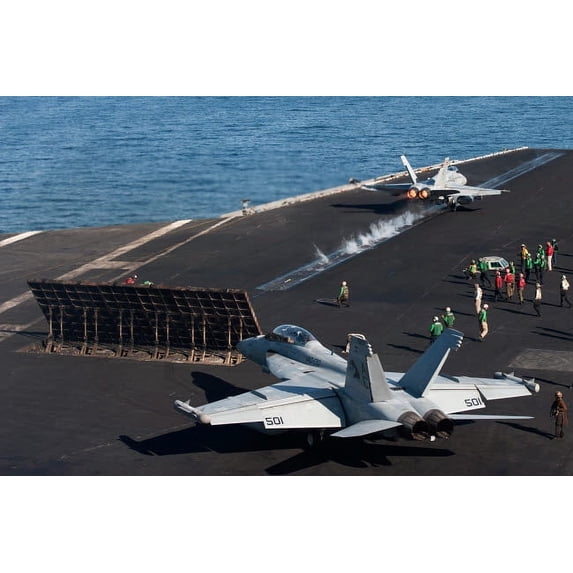 An F/A-18C Hornet launches from the the flight deck of USS Harry S Truman Poster Print by Stocktrek Images (34 x 22)