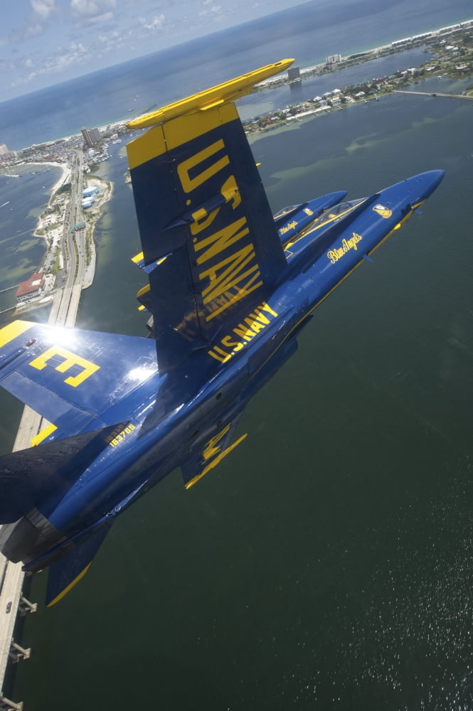 An FA-18 Hornet of the Blue Angels over Pensacola Beach Florida Canvas Art - Stocktrek Images (23 x 35)