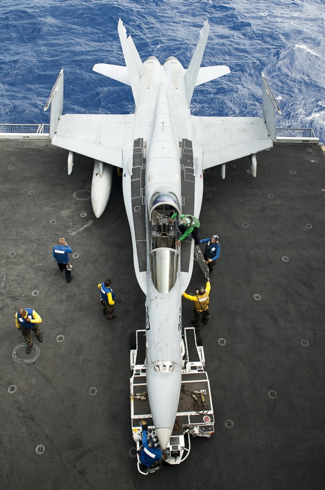 An FA-18C Hornet aircraft on the aircraft carrier USS John C Stennis Canvas Art - Stocktrek Images (23 x 35)
