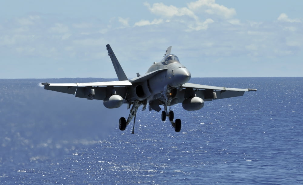An FA-18C Hornet approaches the flight deck of the aircraft carrier USS Ronald Reagan Canvas Art - Stocktrek Images (36 x 22)