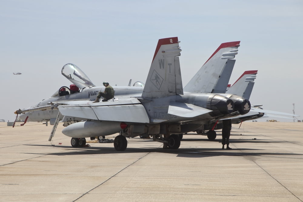 An FA-18C Hornet being readied for flight at MCAS Miramar California Canvas Art - Timm ZiegenthalerStocktrek Images (35 x 23)