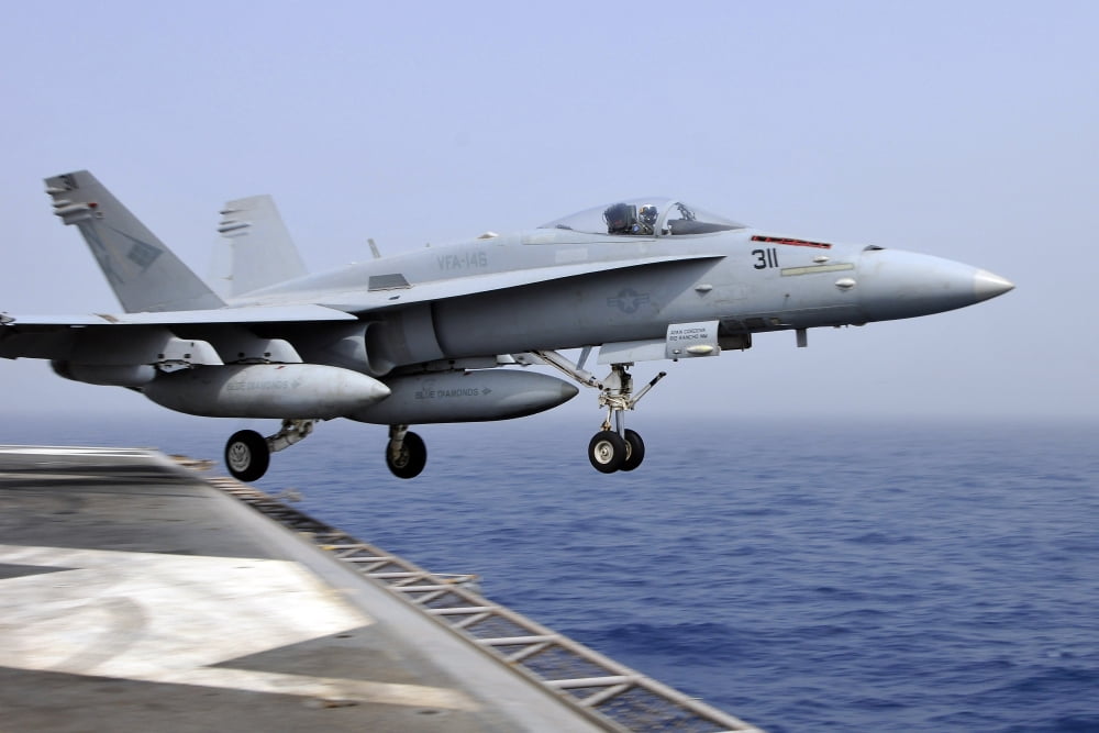 An FA-18C Hornet catapults from the aircraft carrier USS Ronald Reagan Canvas Art - Stocktrek Images (35 x 23)